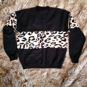 Contrast Leopard and black sweater Sz medium.